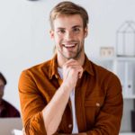 smiling handsome man leaning on table in start up 1080 150x150 1 VanInBox